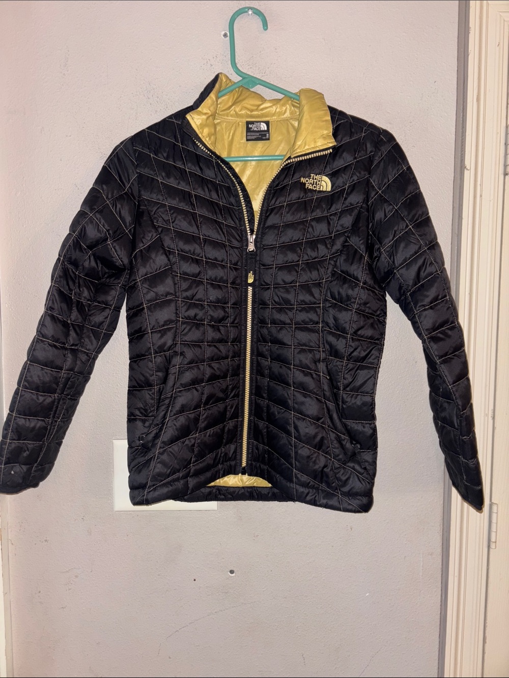 The North Face Black Quilted Puffer Jacket with Yellow Lining